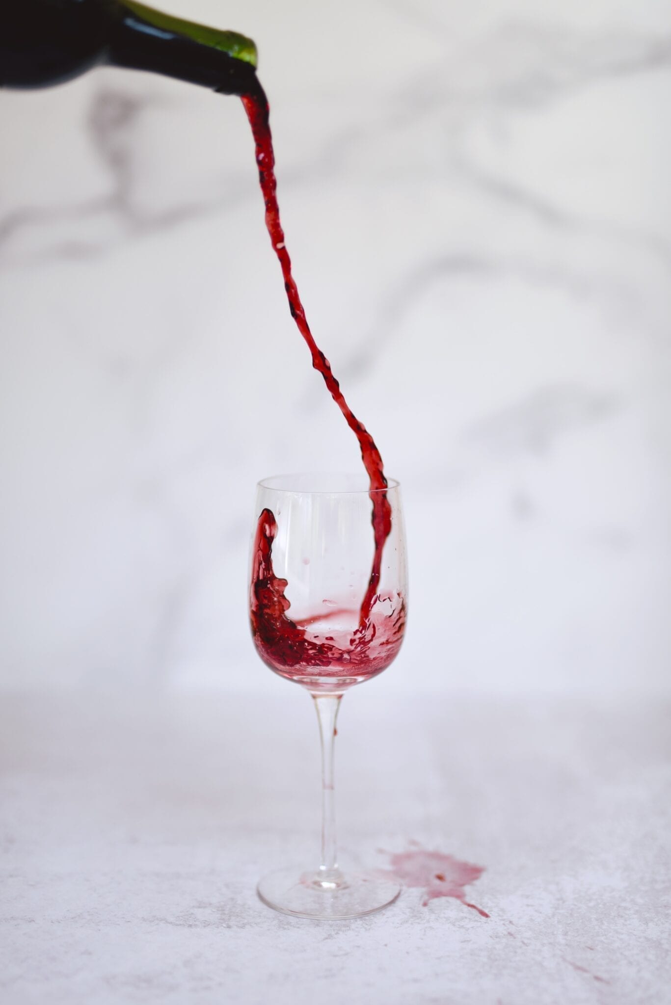 Don’t Overpour Pouring red wine. Photo by Christian Bowen, Unsplash