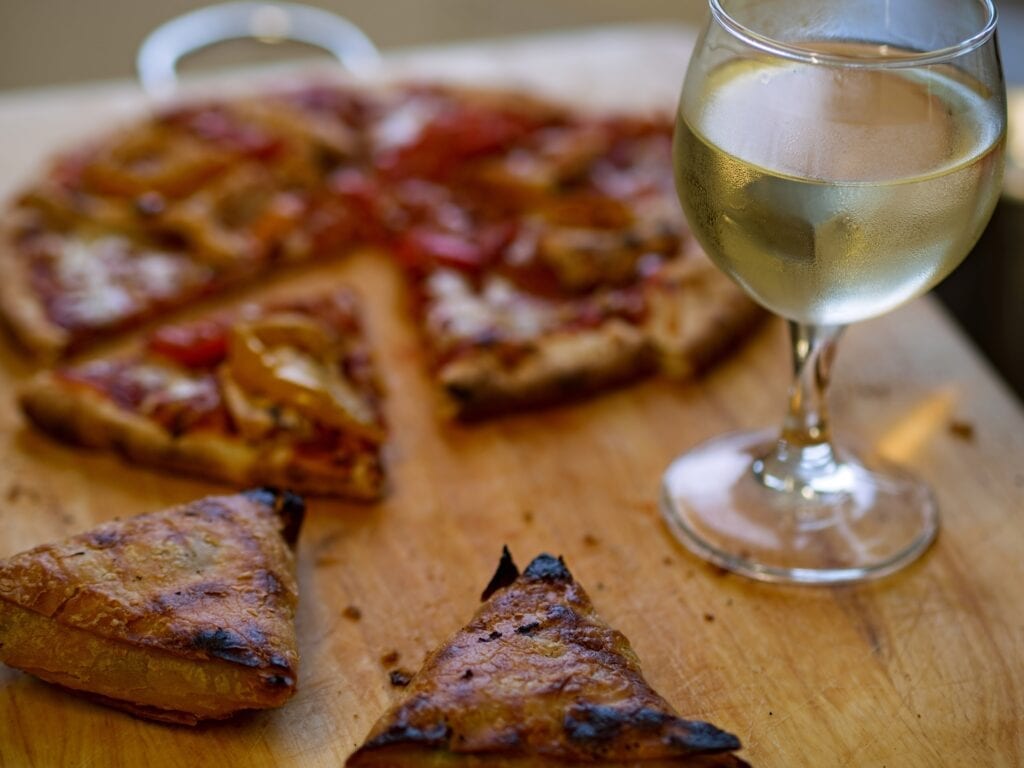 Pizza and wine. Photo by Brett Jordan, Unsplash