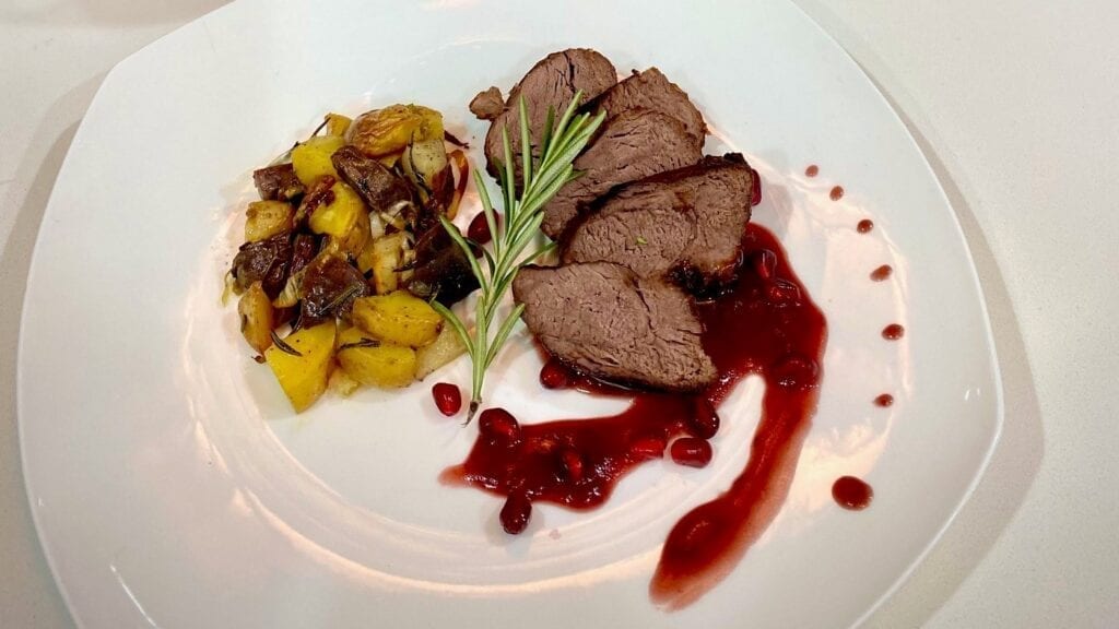 Steak, potatoes, pomegranate