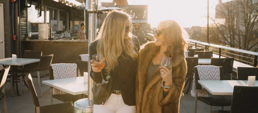 Girls on rooftop with rose wine