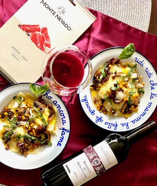 Brunello wine with pasta in two bowls