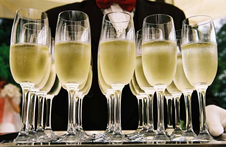 Tray of Champagne glasses being held by a server