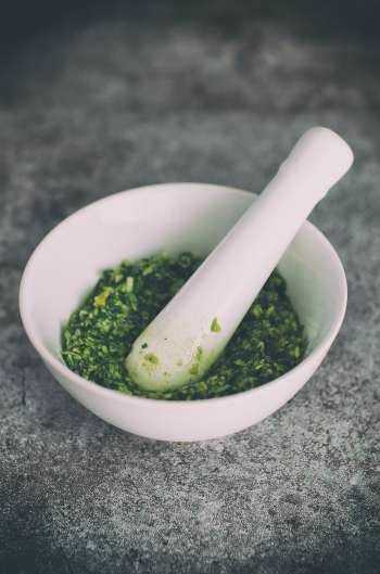 Pesto alla genovese made with mortar and pestle