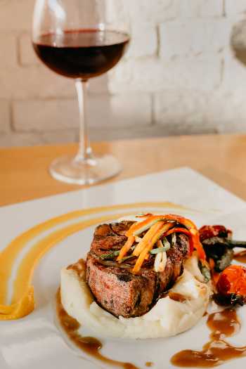 Red wine and steak is a great choice for a dinner party