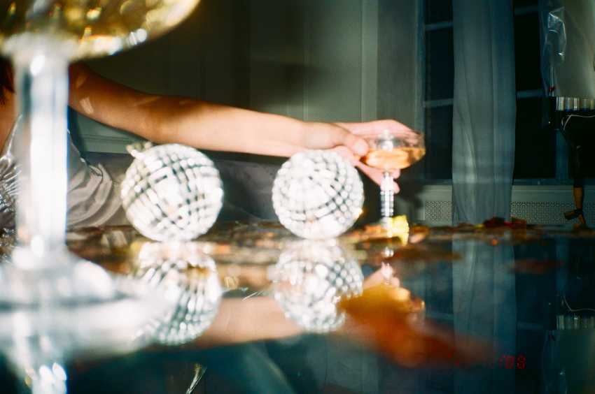 Wine and small disco balls at a dinner party